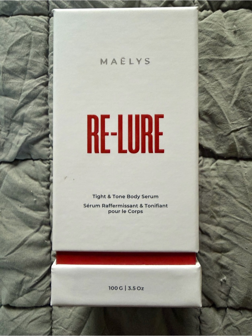 MAËLYS RE-LURE Tight & Tone Body Serum — White with Red Accents